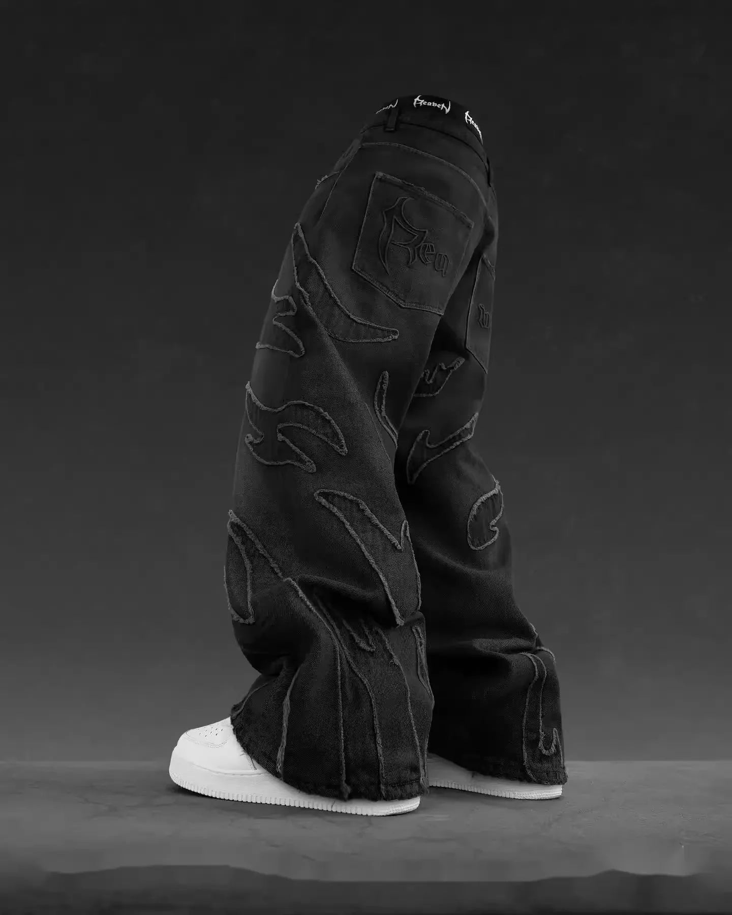Pantalones vaqueros hip hop retro con parches negros